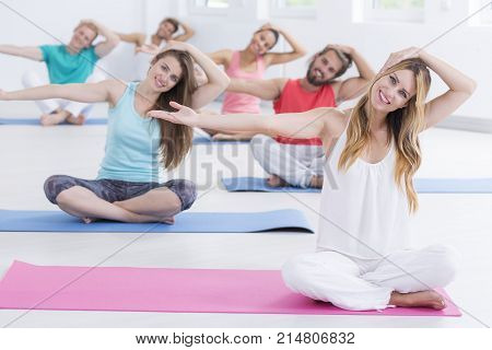 Yogins Doing Neck Stretching Exercises