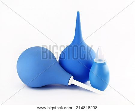 Syringe with a soft tip blue care clean closeup clyster concept