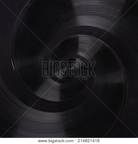 Abstract music vinyl disc spiral fractal background. Retro music vinyl disc abstract fractal. Vintage musical conceptual image swirl pattern background. Spiral effect concept. Music abstract fractal