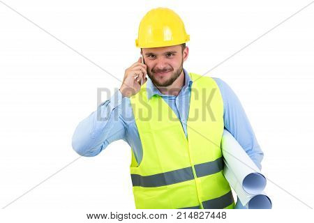 Angry upset young construction engineer yeling at the phone.
