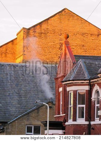 Red Building With Horn And Steam At Sunset Golden Hour