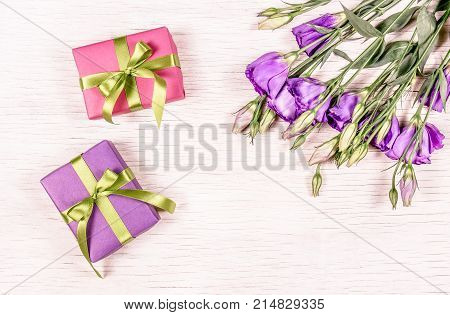 Small gift boxes and flowers. Gift on a white background. Copy space