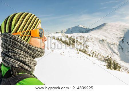 Portrait Of A Girl Traveler By Mountains, With Glasses, Hat And Buff