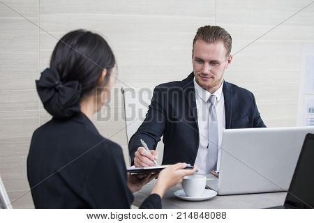 Man Discussing With Woman For Project With Attractive Smiling  At Office. Businessman With Happy Emo