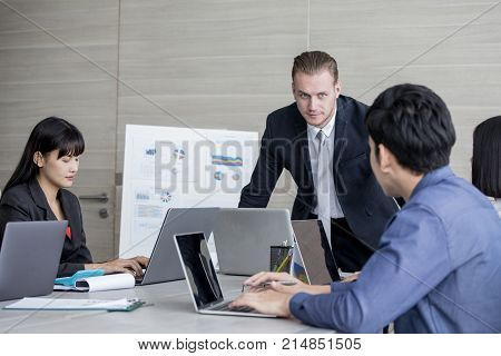 Young Business People Working Together With Serious Emotion. Business People Takling In Modern Offic