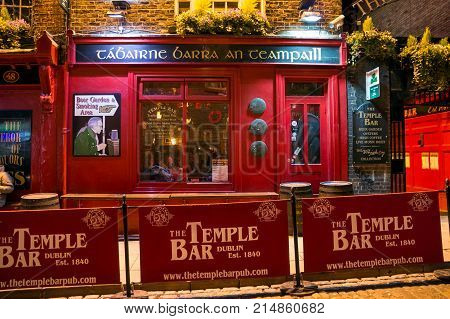 DUBLIN IRELAND - FEB 15 2014: The Temple Bar pub. Temple Bar historic district is known as Dublin's cultural quarter with lively nightlife.