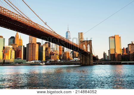 New York USA. View of Manhattan bridge and Manhattan in New York USA in the morning. Clear blue sky with skyscrapers
