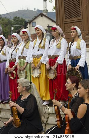 SARAJEVO, BOSNIA AND HERZEGOVINA - AUGUST 17 2017: Group of bosnian musician in front of sebilj fountain traditionally dressed