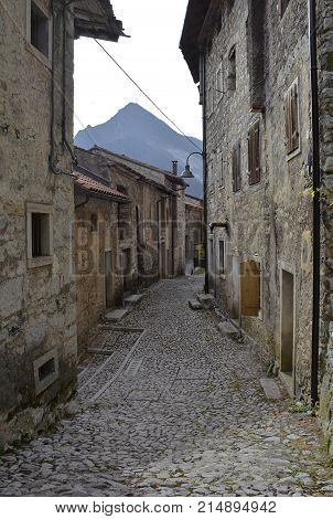 A small street in the hill village of Erto in Friuli Venezia Giulia north east Italy. The village is famous locally for having being evacuated following the 1963 Vajont Dam disaster.
