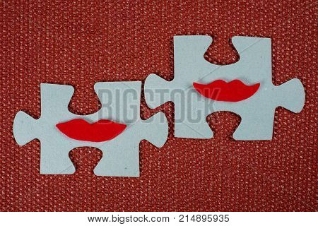 Close-up Of Two Parts Of A Puzzle. Symbolic Women With Lips. The Concept Of Psychological Compatibil