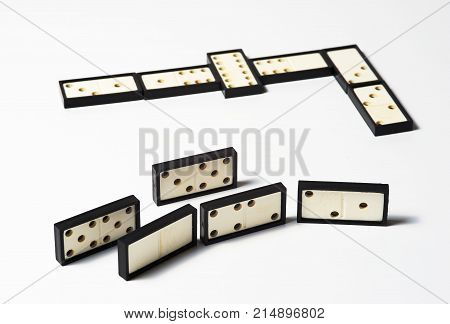 Chain of domino pieces on wnite background