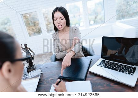 The couple went to a lawyer to conclude an agreement on the divorce. They quarrel and argue with each other. Lawyer prepares documents.