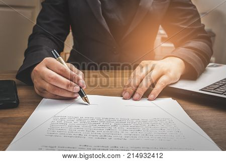 Business Man Signing Terms And Agreement Document On Workingspace, Business Signing Concept