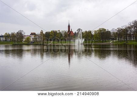 Lake Druskonis and view of the embankment in Druskininkai in cloudy weather