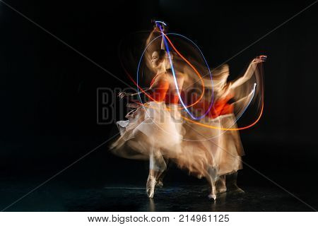 Dance class. Attractive gracious skillful woman doing dance figures and smiling while practicing her dance