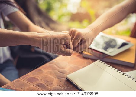 Business partnership giving fist bump to Start up new project. Business and Teamwork of Partnership concept. Corporation meeting in company or industrial work concept.