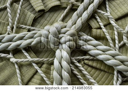 Knotted rope on a sake barrel close up in Jpan