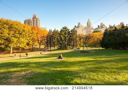 New York City, USA - Nov 9, 2011: People in Central Park in autumn with clear blue sky.