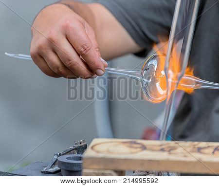 Glass worker in action (public demonstration) on the street.