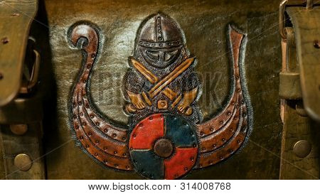 Nordic Warrior Picture On Leather Box For Board Game. Folk, Handmade And Craft Concept