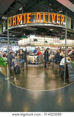 VIENNA, AUSTRIA - CIRCA MAY, 2019: people at Jamie Oliver in Vienna International Airport.