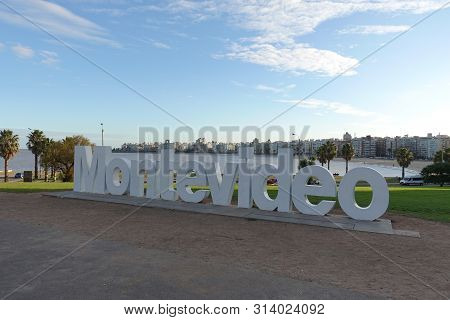 Montevideo/uruguay-6/1/19: Montevideo Sign And Skyline At The La Rambla On A Beautiful Sunny Winter 