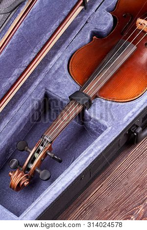 Violin In Opened Velvet Case. Musical Instrument Violin On Wooden Background. Classical Orchestra In