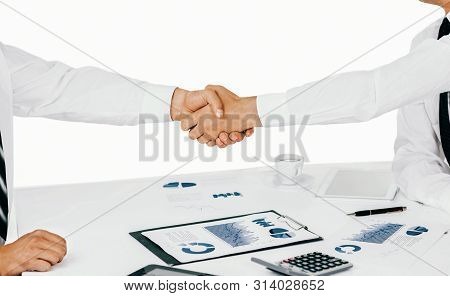 A Group Of Successful Businessmen. Discussion Of Charts And Grap