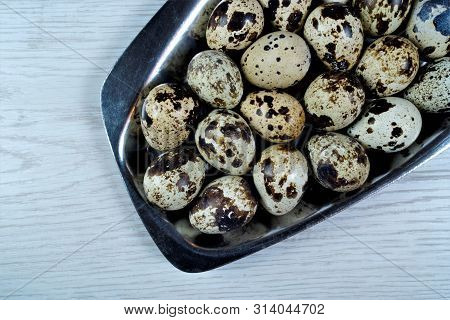 Quail Eggs Are A Food Product-- The Bird Partridge. The Egg Shape Is Oval, Brown Spotted Color, The 