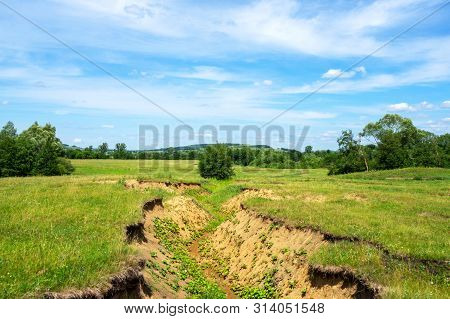 A Deep Ravine Caused By Soil Erosion Due To Heavy Rains.
