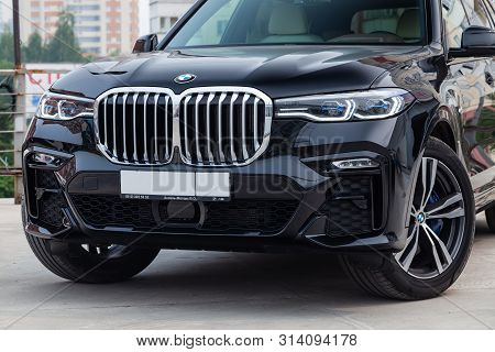 Novosibirsk, Russia - 07.20.2019: Black New Bmw X7 Xdrive40i 2019 Year Front View With Light Gray In