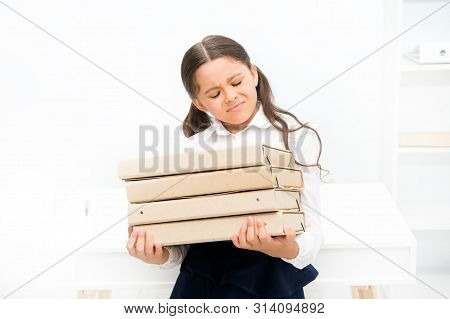 So Heavy. Small Girl In School Uniform. Lot Of Homework. Get Information. Kid Learn And Study Hard. 