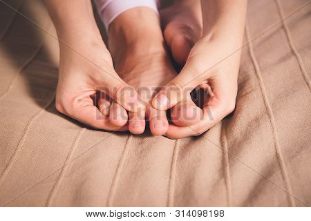 Woman's Leg Hurts, Pain In The Foot, Massage Of Female Feet