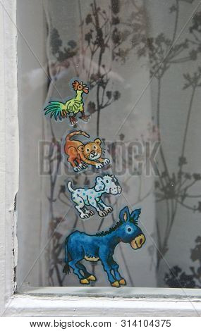 Stickers Of The Town Musicians On The Window In Medieval Street Schnoor In The Centre Of The Hanseat