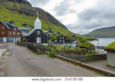 Bour Village. Typical Grass-roof Houses And Green Mountains. Vagar Island, Faroe Islands. Denmark. E