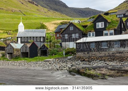 Bour Village. Typical Grass-roof Houses And Green Mountains. Vagar Island, Faroe Islands. Denmark. E