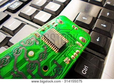 Green Electronic Board On The Keyboard. Repair Of Equipment. System Administrator.