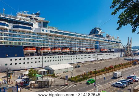 A Large Luxury Cruise Liner Moored In The Port Of The Adriatic Sea, Is Waiting For Passengers. There