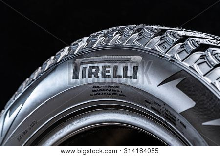 Logo Pirelli In Sidevall Black Tire. Black Bacground.