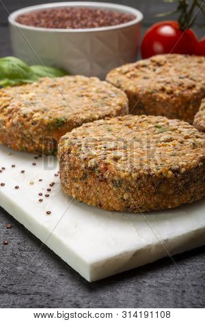 Tasty Vegetarian Burgers Made From Healthy Quinoa, Basil, Tomatoes And Mozzarella Cheese