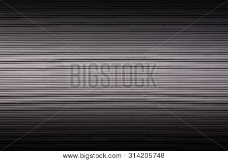 Metal Wall With Invisible Light Sources That Illuminate The Midd