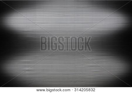 Metal Wall With Invisible Light Sources That Illuminate The Midd