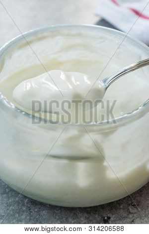 Homemade Goat Yogurt In Glass Bowl With Spoon / Probiotic Custard
