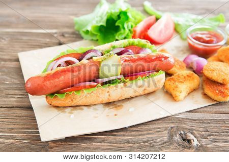 Delicious Fast Food. Hot Dog With Grilled Sausages, Onions And Vegetables.