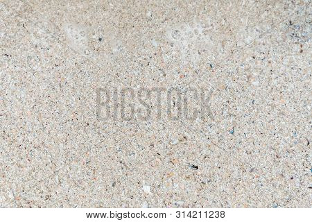 The View From The Top. Summer Beach, Sea Background Of Sand And Clear Water With Foam On The Ocean. 