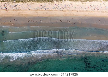 Ocean Waves, Sandy Beach With People Bathing In The Water, View From Drone, Lanzada Beach, Galicia,