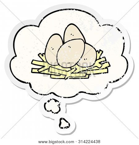 cartoon eggs in nest with thought bubble as a distressed worn sticker