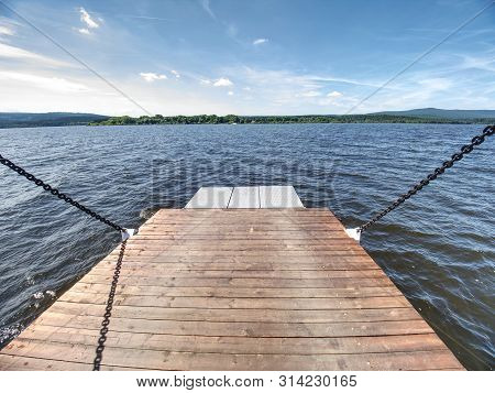 Shipping On Ferry Boat Ship With Open Ramp And Empty Car Deck. Wooden Board For Cars And Passenger