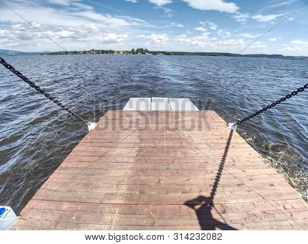 Shipping On Ferry Boat Ship With Open Ramp And Empty Car Deck. Wooden Board For Cars And Passenger