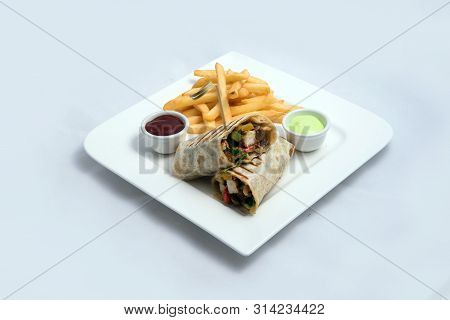 A Low Contrast Hero Shot Of A Chicken Pimiento Sandwich With Samurai & Alger Sauce & Fries On The Si